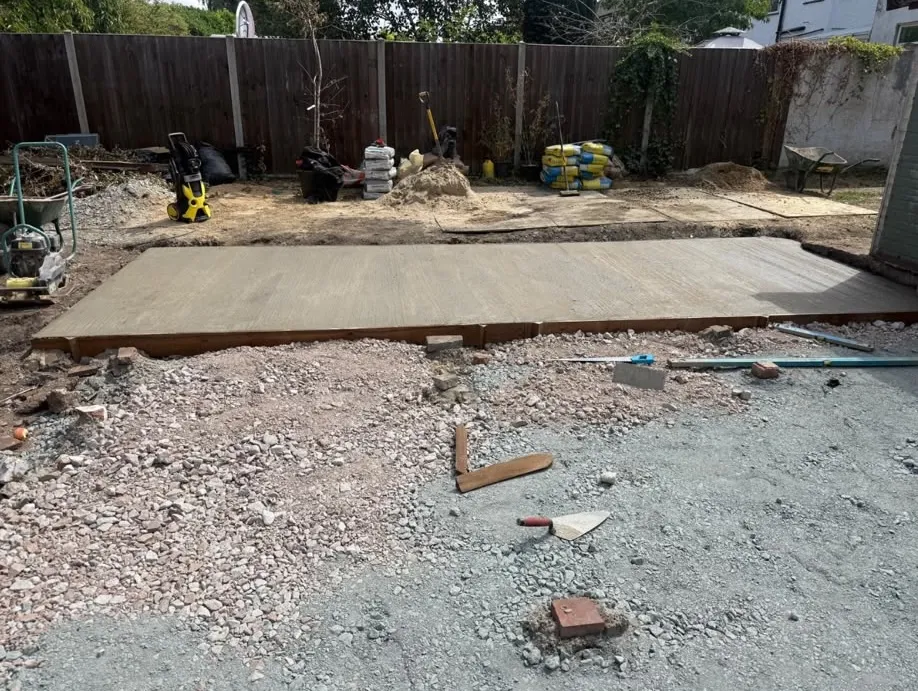 Freshly poured concrete sub-base during a Beckenham garden build by Prestige Landscapes