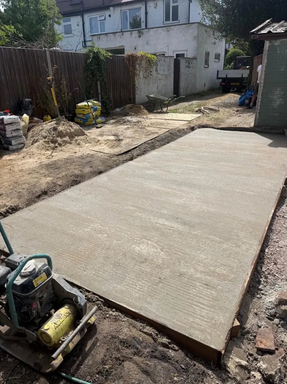 Newly poured concrete base for a garden room in a Beckenham garden